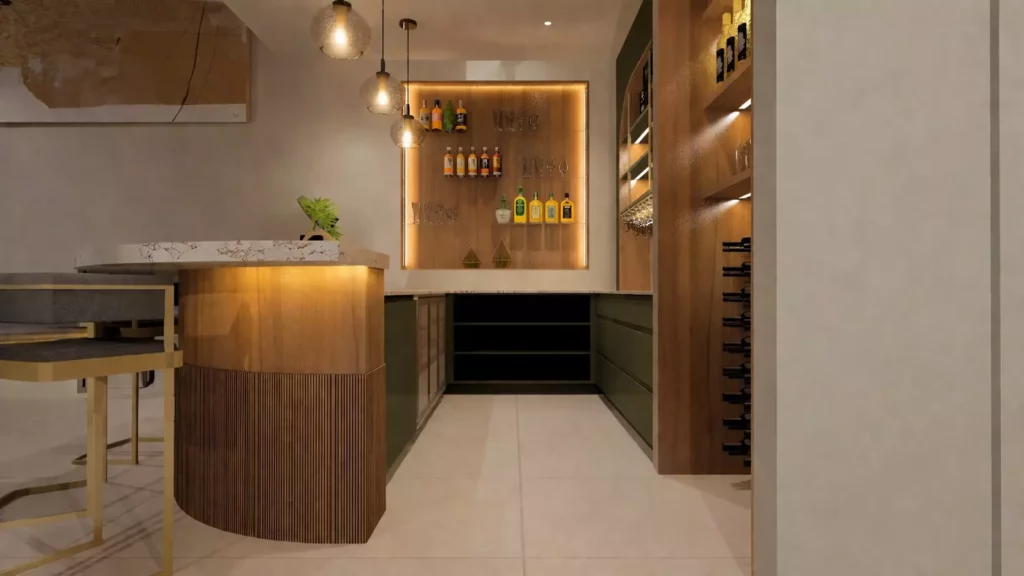 A warm and inviting home bar area featuring a curved, marble-topped counter with a wood-slatted base and integrated under-counter lighting. The back wall showcases a recessed display shelf for spirits with ambient LED lighting, complemented by a dedicated wooden wine rack and green cabinetry